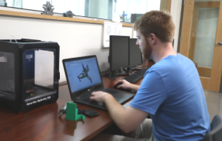 Man Typing on a Computer