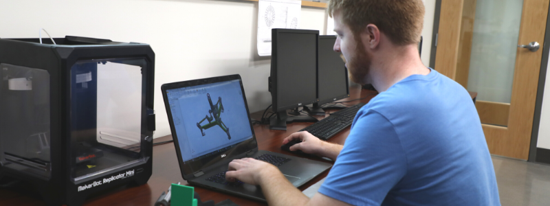 Man Typing on a Computer