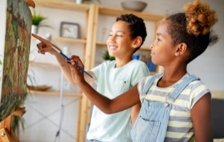 Two Children Painting