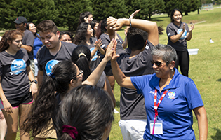 Woman giving a LIFE student a high five