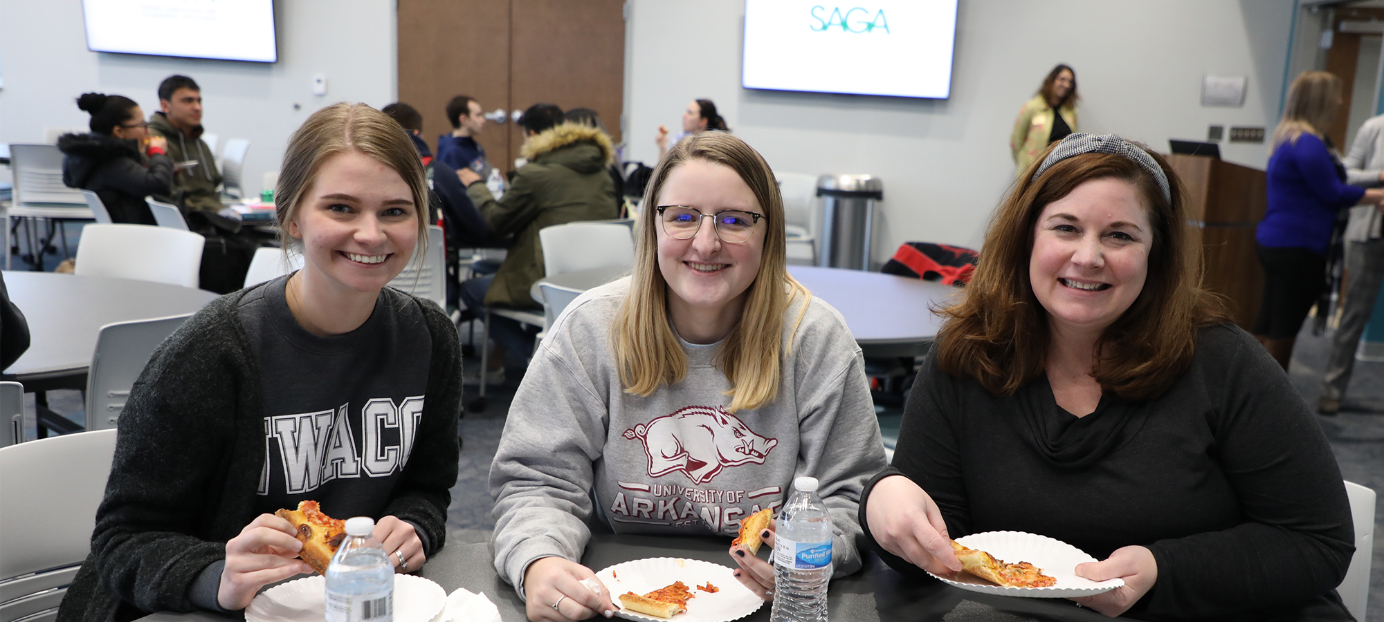 Three Female Students Sitting at a Table